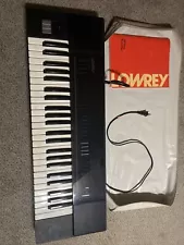 Lowrey Micro Genie Model V-100 Keyboard With Book And Cover