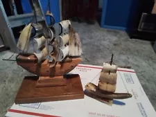 One large one small Sailboat With real Horn Sails