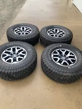 Ford F150 Raptor wheels and tires.