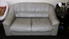 Gray leather loveseat couch, used but fully functional