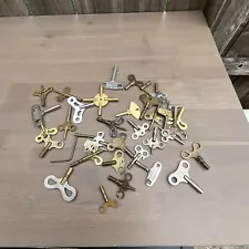 large group of 35 assorted clock keys . useful lot for collectors .