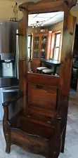 antique hall tree with mirror, storage seat and 6 pegs for coats