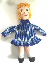 fully crocheted blonde doll, entire doll is yarn except eyes, in blue dress