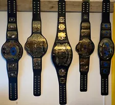 New Listingset of WWE Replica Title Belts- owned less than a year. Bought from the WWE Shop