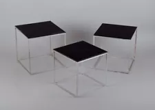 Poul Kjærholm, Danish furniture designer. Set of nesting tables PK 71.