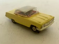 Atlas Chevy Impala (Yellow/White) 1/64 scale slot car