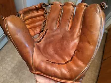 Nokona baseball glove and baseball spikes