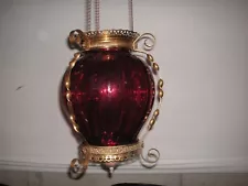 ANTIQUE BRASS HANGING KEROSENE LAMP, CRANBERRY GLASS SHADE