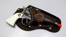 Vintage BUCKEROO Diecast Metal Cowboy Toy Cap Gun with Ornate Leather Holster