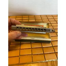 Chromatic C harmonica in original box.