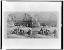 Winnebago Indians wrapped in blankets sit in a clearing c1900 Old Photo