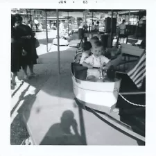 photographers shadow boy in amusement park boat ride 1963 vintage snapshot photo