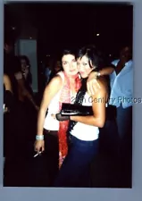 FOUND COLOR PHOTO E_5806 PRETTY WOMEN POSED HUGGING,ONE SMOKING CIGARETTE