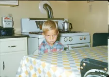 1950s Boy Sitting at Kitchen Table Scowling at Camera 35mm Red Border Slide