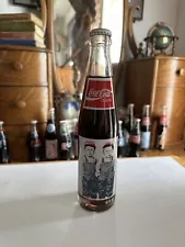 This Sale Is For (1) Kull Brothers 100th Anniversary Tall 10oz Coca Cola Bottle