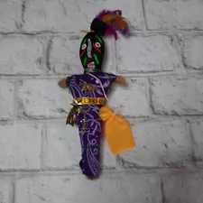 Purple Voodoo Doll from New Orleans with black and white pins