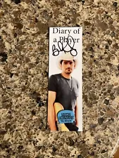 brad paisley signed diary of a player bookmark and Guitar Pick taped in back