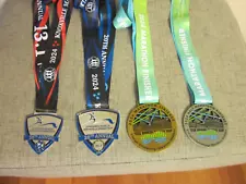 Race medals: Marathon and half-marathon collection.