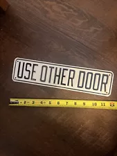 “USE OTHER DOOR” Sign. Sale Helps Mercy Hospital Ships