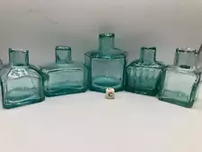 5 old aqua glass inkwells, penny inks (C)