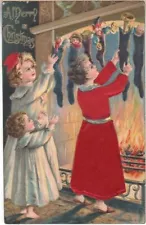 POSTCARD XMAS EMBOSSED SILK CLOTHES & BOW A MERRY CHRISTMAS POSTCARD 1908