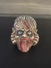 zombie head figurine