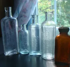 New ListingANTIQUE LOT OF FIVE EMBOSSED MEDICINE BOTTLES