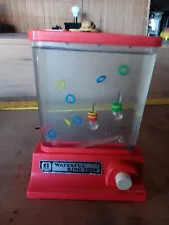 Vintage 1976 Tomy Waterful Ring Toss Handheld Puzzle Water Game Works Great.