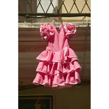 Pink Flamenco Dress For Little Girl Hangs In Centro Old District Of Sevilla