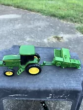 John Deere Tractor With Baler Missing A Wheel On Baler And Hay