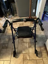 Used walker with wheels and seat. In very good condition.