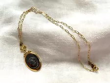 Gold tone necklace with black cameo 18"