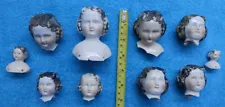 10 old painted china doll heads , damage ,