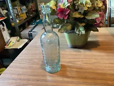 antique whiskey bottle - London England - lots of embossing