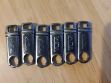 TUMI Zipper Pulls for Sale. Six Pieces.