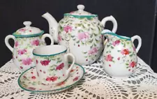 Antique 8 piece Tea Set for 1 Pitcher, Creamer, Sugar and defuser floral design