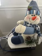 White And Blue Snow Man On A Blue Bob Sled White N Blue Ropes