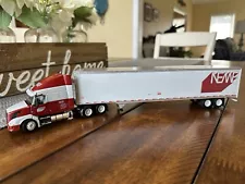 DCP 1/64 NEMF Volvo VNL 670 w/ Matching 53’ Dry Goods Trailer #32075