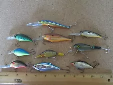 Lot 135 - 10 fishing lure lures out of old tackle box