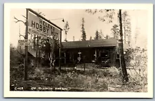 Postcard RPPC OR Helen's Hobby Hut McKenzie Hwy Oregon Cougar Skins For Sale AX9