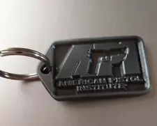 VINTAGE PEWTER KEY RING API AMERICAN PISTOL INSTITUTE