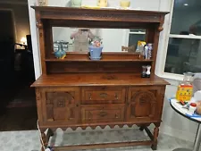 Jacobean revival style carved walnut and inlaid mirror back buffet sideboard.