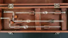 vintage old medical science glass tubes beakers lab equipment in wooden box