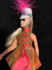 Majorette Doll With Blonde hair, pink/metallic uniform, boots, hat