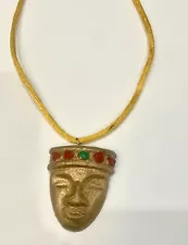 Gold Colored African Mask Pendant On Yellow Cord Necklace