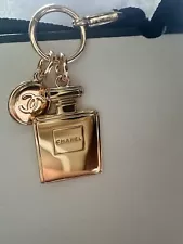 CHANEL CHARM BEAUTY GIFT GOLD METAL LOGO BOTTLE CHARM AND ROUND IN BOTH SIDES