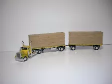 DCP FIRST GEAR 1/64 MAGGI W/T FLAMES PETE 379 DAYCAB&DUAL 28.5' FLATBEDS&HAYLOAD