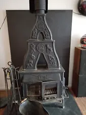 indoor cast iron wood burning stove with slate platform
