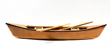 Canoe brown wood 11 inches long with wood paddles and cane seat