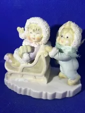 O'Well Baby Boy in Blue Pushing Girl in Pink on Christmas Sleigh Snow Figurine